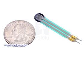 Force-sensing resistor (0.2inch circle) with US quarter for size reference